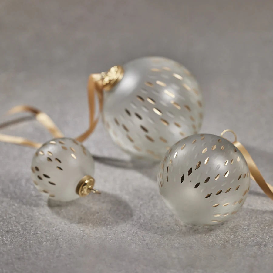 Frosted & Etched in Gold Glass Ornaments laying down 